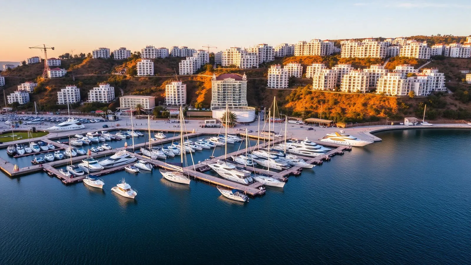 Marina Dinevi in Saint Vlas with white yachts moored in front of seafront apartment blocks
